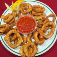 Fried Calamari w/ sauce · Calamari dipped in house-made batter & fried. Served with red sauce.