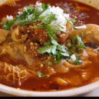 Menudo · Breakfast of champions. Honeycomb tripe and beef feet cooked with our red chili sauce and se...