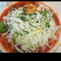 Posole · Cooked bone in pork hominy and simmered with special red chili sauce, served with diced onio...