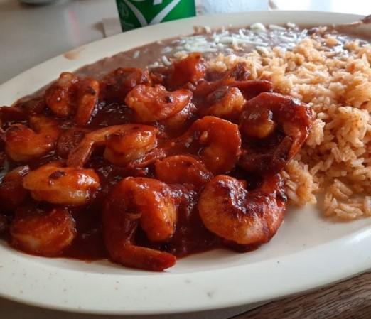 Camarones a la Diabla · Prawns sauteed in butter and our special spicy red sauce.