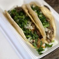 Gringa · Flour taco. Soft flour tortilla with your choice of meat, topped with cheese, onions and cil...