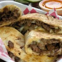 Quesadilla · 12'' flour tortilla, cheese and your choice of meat. Onion and cilantro upon request.