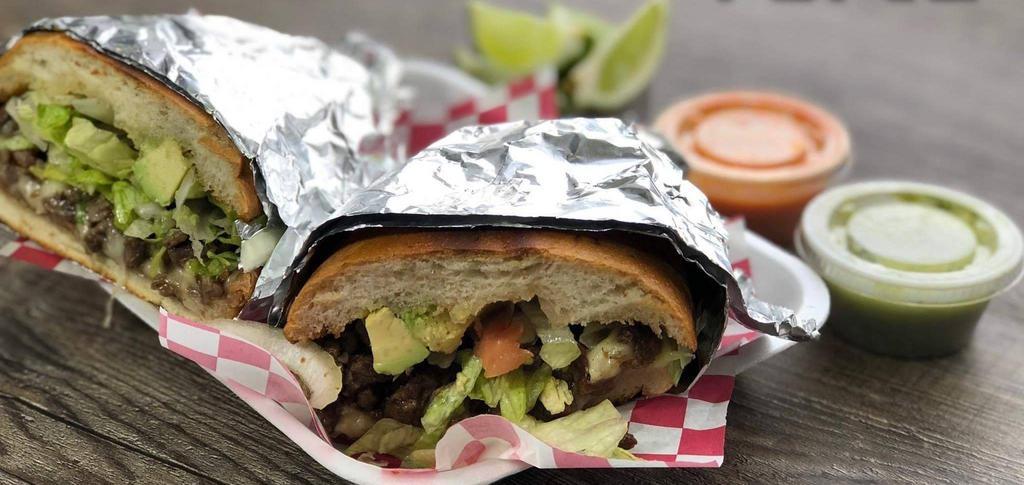 Torta · Mexican sandwich bread, beans, cheese, lettuce, tomatoes, avocado and your choice of meat.