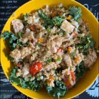 Quinoa Bowl · Quinoa mixed with sweet peppers and onions, feta cheese, on a bed of mixed greens, drizzled ...