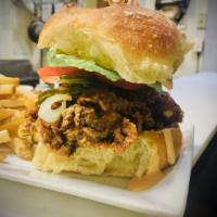 Pickle Brined Fried Chicken Sandwich  · Pickle Brined fried chicken on a snowflake roll with pickles, lettuce, tomato & chipotle ran...
