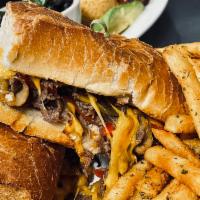 Philly Cheese Steak Sandwich · Mushrooms, onions, mixed pepper and cheese. Served with fries.