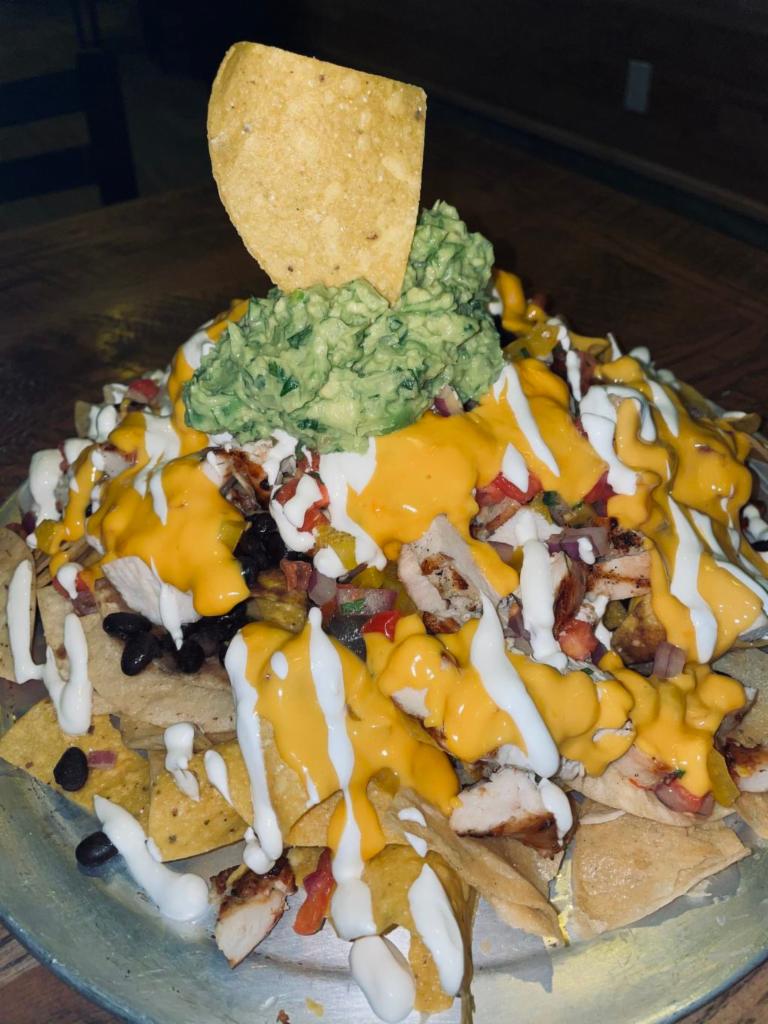 HOME RUN NACHOS · onions,cilantro,onions, black beans, cheese sauce
guacamole, sour cream, and a lot more cheese sauce.
your choice of protein.
