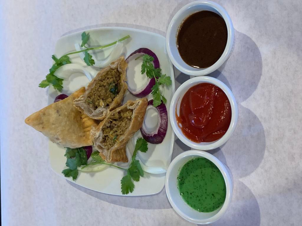 Meat Samosa · Lamb. Crispy triangular pastry turnovers filled with minced lamb seasoned with potatoes and green peas.
