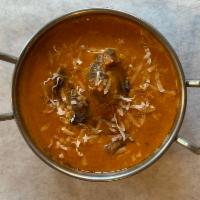 Goat Korma · A moghulai delight cardamoms flavored sweet and spicy curried bone-in goat in cream, cashews...