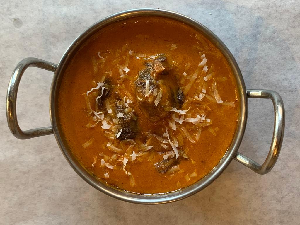 Goat Korma · A moghulai delight cardamoms flavored sweet and spicy curried bone-in goat in cream, cashews, and raisins.
