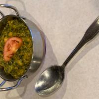 Chana Saag · Spinach and chick-peas (garbanzo beans) cooked with thick gravy sauce.