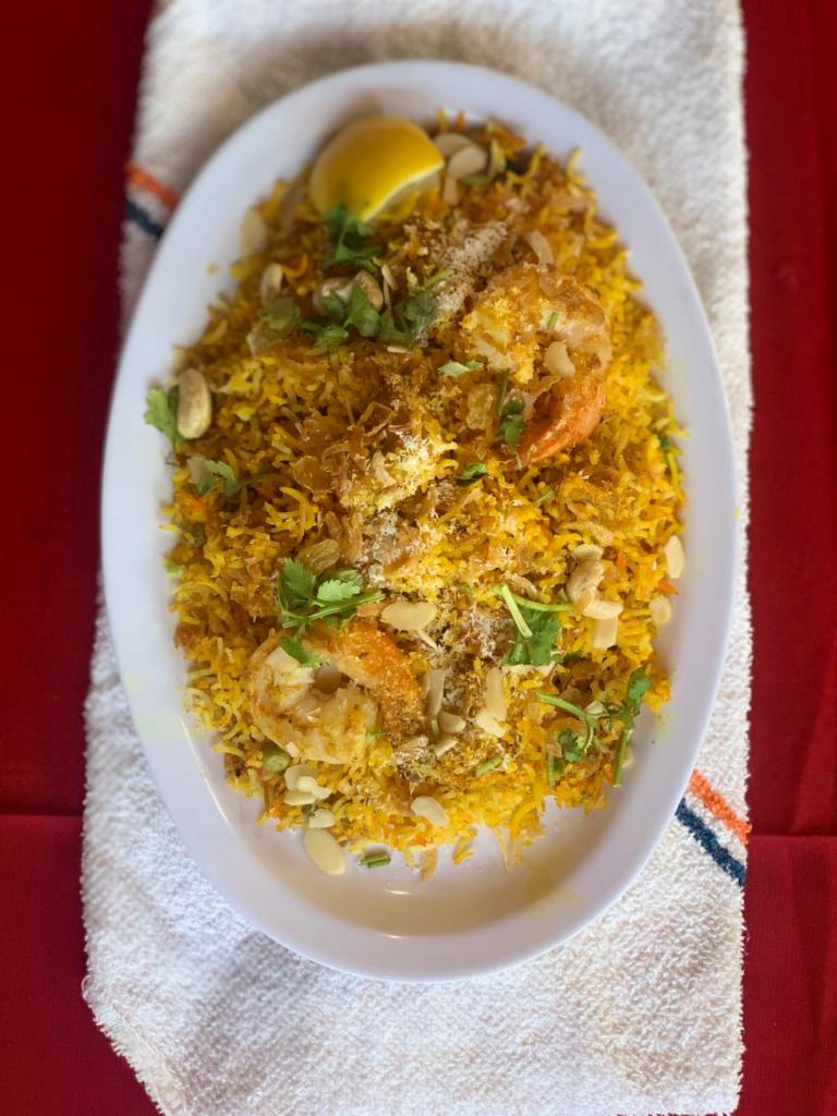 Chef Special Biryani · Basmati rice cooked with lamb, chicken, and shrimp topped with fried onions and herbs.