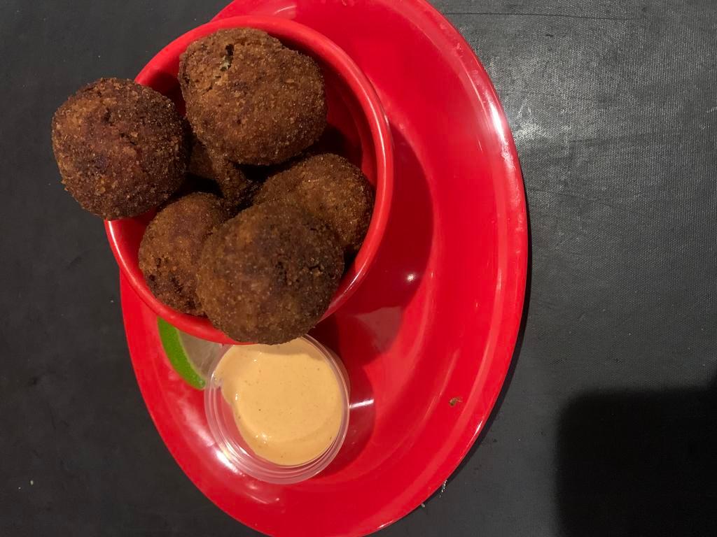 Spicy Fried Boudin Balls · Fried sausage that has been rolled into a ball.