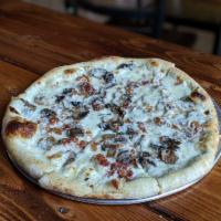 White Pie  · Our white sauce, bacon, tx mushrooms.
