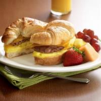 Sunshine Croissant · Fresh-cracked egg, melted cheddar and your choice of breakfast sausage, crispy bacon or nitr...