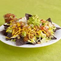 Taco Salad · Your choice of Chili, Southwest chicken chili, or Corn & Black bean mix served on a bed of l...