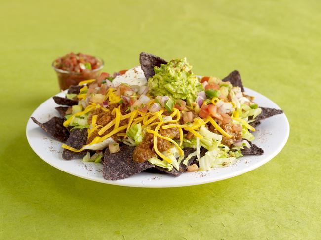 Taco Salad · Your choice of Chili, Southwest chicken chili, or Corn & Black bean mix served on a bed of lettuce and tortilla chips with cheddar cheese, pico de gallo, sour cream, guacamole, and spices. Served with Salsa on the side.