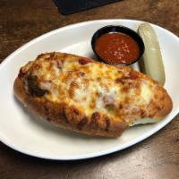 Hot Stuffed Cheesey Baked Meataball Sandwich · side of sauce, krispy housemade  thin chips, pickle