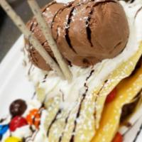Happy Chocolate Crepe · Chocolate ice cream, chantilly, pucky sticks, brownie, caramel syrup and M&M's.