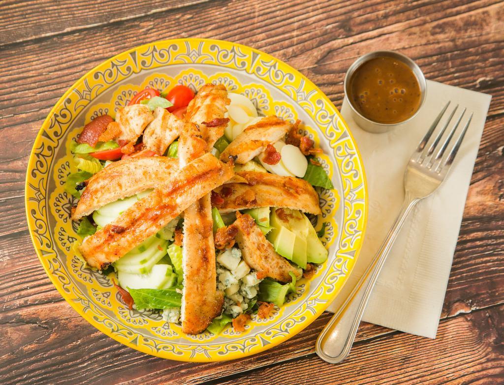 Cobb Salad · Romaine lettuce, cherry tomatoes, cucumber, avocado, bacon, sliced boiled egg and crumbled blue cheese.