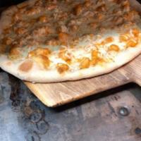 Buffalo Chicken Pizza · Chicken pieces sauteed in a Buffalo sauce prepared on a round pizza crust with blue cheese d...