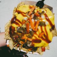 D.T.E. Nachos · Braised pork, tortilla chips, nacho cheese, BBQ and giardiniera peppers.