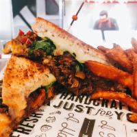 Brisket Grilled Cheese Sandwich · Braised brisket, cheddar cheese, provolone cheese, Muenster cheese, peppadew peppers, carame...