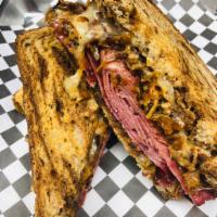 MKE Rueben Sandwich · Spotted cow braised corn beef, pepper jack and Swiss blend cheese, bacon kraut and boom boom...
