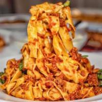 Pappardelle alla Bolognese  · Fresh long ribbon pasta, beef and pork meat sauce. 