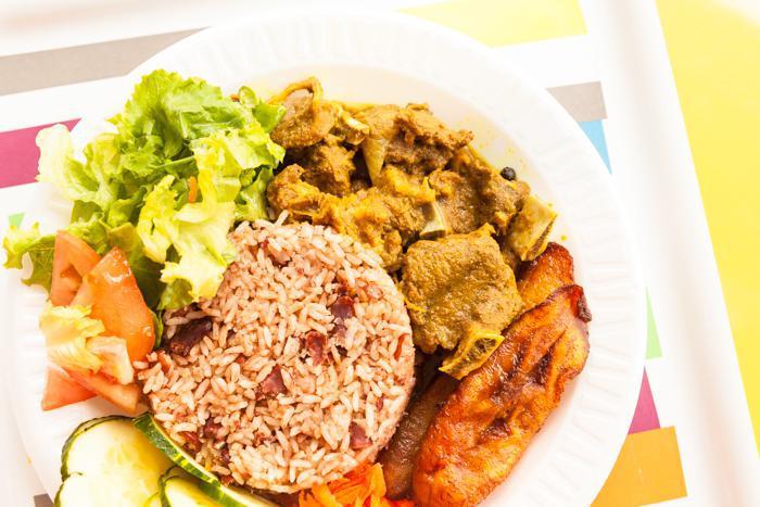 Curried Goat · Includes house salad and two regular sides.