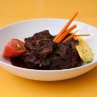 Brown Stew Beef Oxtails · Includes house salad and two regular sides.