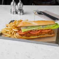 Schnitzel Sub · Crispy fried Schnitzel Topped with
lettuce, tomato, spicy-schug mayo on a toasted baguette.