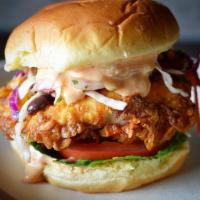 Crispy Fried Chicken Sandwich · Batter-coated, crispy fried chicken breast Topped with lettuce, tomato, slaw, pickles, and s...