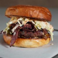 NY Deli Burger · Housemade 6OZ burger patty, grilled housemade Pastrami, Coleslaw, Caramelized Onions, Lettuc...
