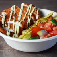 Schnitzel Bowl · Schnitzel, Streats Fries, Israeli Salad, Pickles, Spicy Schug Mayo.