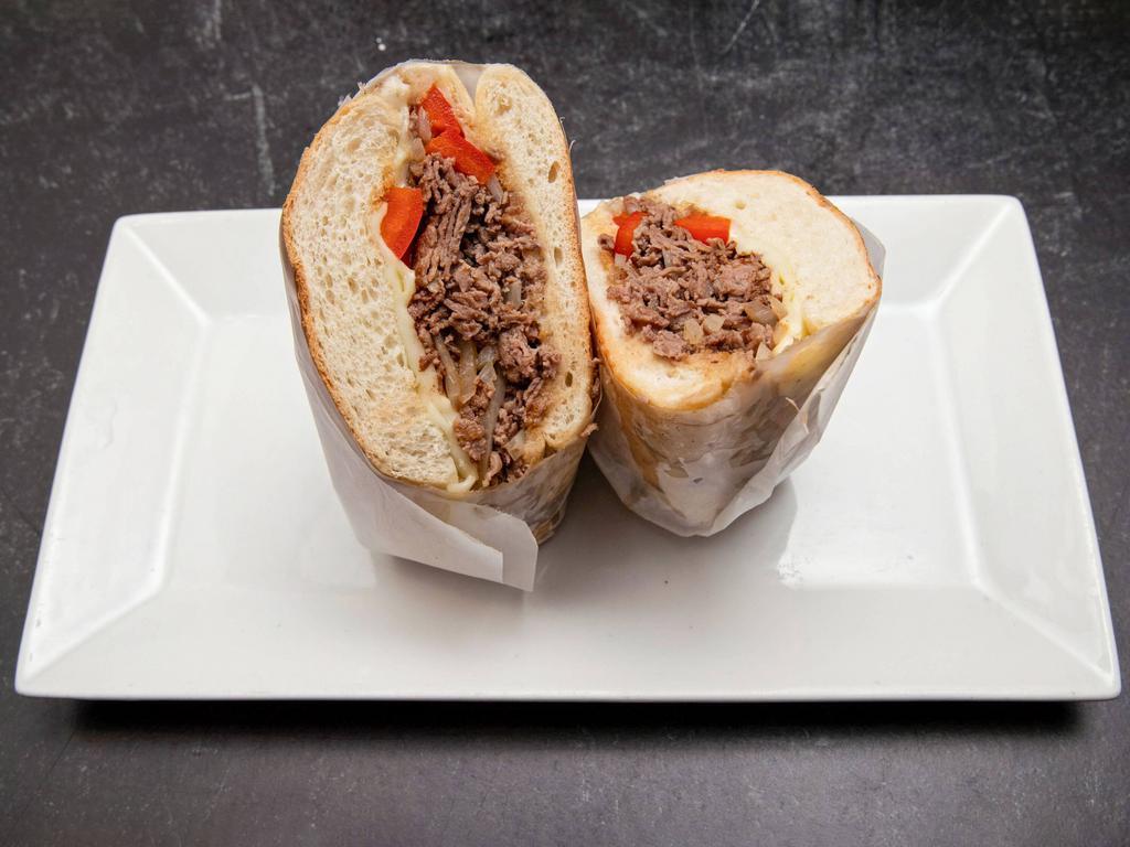 Philly Cheese Steak Sandwich · grilled roasted beef, mozzarella, peppers, onions, steak sauce