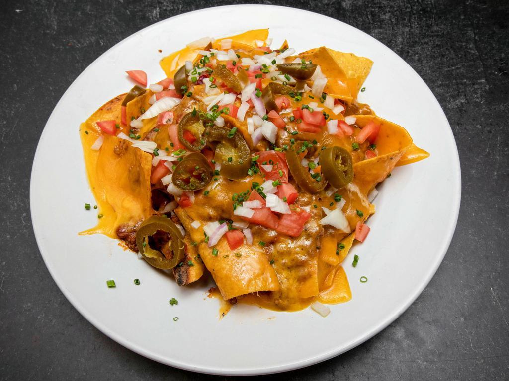 Nachos Grande · nachos with 
Chopped tomatoes, cheddar cheese, onions and jalapenos. Served with sour cream, salsa and guacamole.