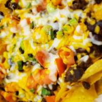 Loaded Nachos · Tortilla chips topped with cheddar, mozzarella, black olives, tomatoes, jalapenos, chili and...