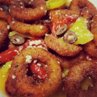 Calamari Sicilian · Fried calamari tossed in a lemon garlic sauce with roasted red peppers, black olives and ban...