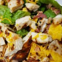 Southwest Salad · Chopped romaine topped topped with shredded cheddar cheese, bacon and tortilla chips. Served...