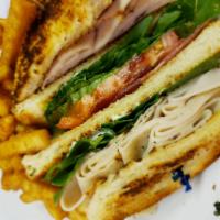 Turkey Club · Triple decker sandwich with turkey, bacon, lettuce, tomato and mayo on toasted white bread. ...