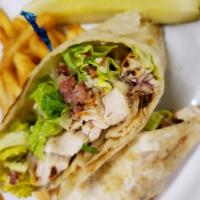 Chicken Caesar Wrap · Grilled chicken with lettuce, Parmesan, red onion, bacon bits and Caesar dressing. Served wi...