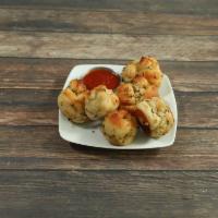 Garlic Knots · 6 pieces. Served with a side of marinara sauce.