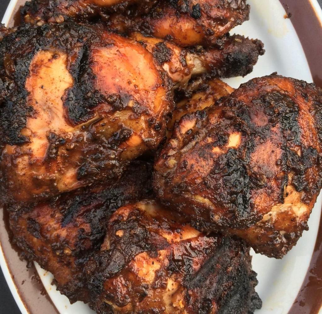 Jerk Chicken · Chicken rub and marinated with Jamaican spices and grilled slowly on charcoal grill.