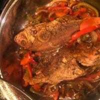 Brown Stew Snapper · Snapper fried then cooked down in a flavor brown sauce.