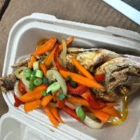 Escovitch Snapper · Red snapper seasoned to perfection, fried with toppings of onion, peppers, carrots in vinega...