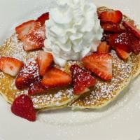 Straw Pancake Platter · 3 buttermilk pancakes topped with sweet glazed strawberries and whipped cream. Served with 2...