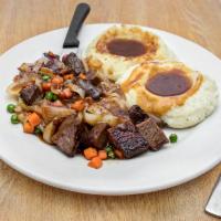 Stacks Famous Pot Roast Dinner · Tender braised beef, green peas, carrots, and onions topped with beef gravy. Served with 2 s...