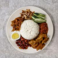 34. Nasi Lemak 椰浆饭 · Malaysian popular coconut rice served with egg, cucumber, anchovies, onion, sambal, peanut, ...