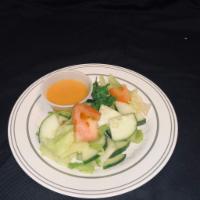 House Salad · Mixed greens with cucumber and tomato. Served with ginger dressing.